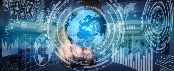 Businessman holding digital charts and globe
