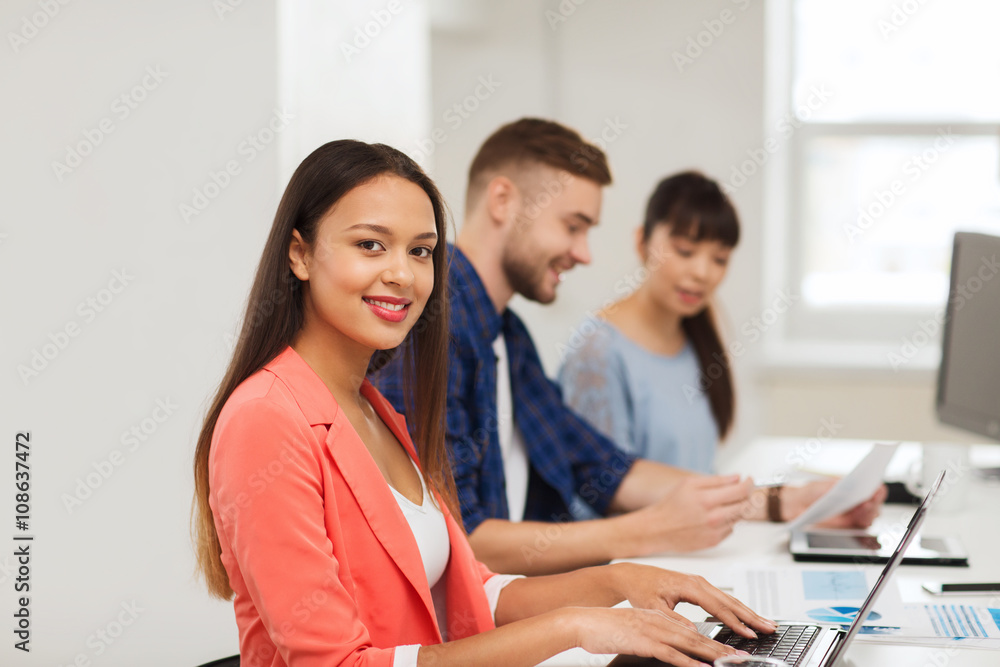 Poster happy african woman over creative team at office