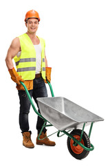 Worker posing with an empty wheelbarrow