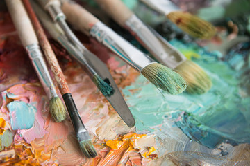 Obraz premium macro artist's palette, texture mixed oil paints in different co