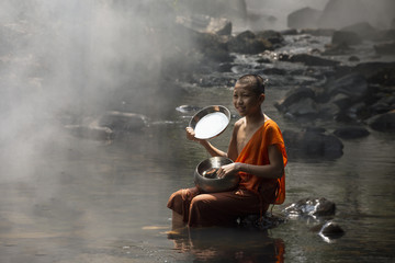 Novice Monk in river.