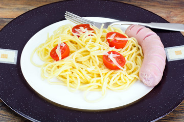 Eating Fast Food: Pasta with Sausage on Plate