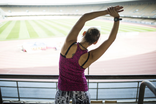 Woman runner doing stretching