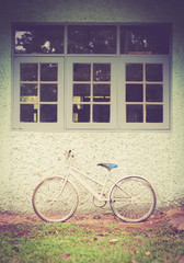 Fototapeta na wymiar Vintage bike against wall,vintage tone style