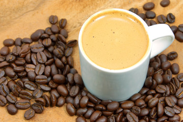 Coffee and coffee bean on wood background