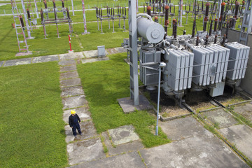 Worker in  high voltage switchyard