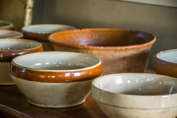 A collection of old, antique, stoneware kitchen bowls.