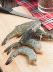 Raw shrimps on wood