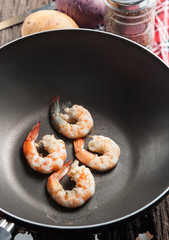 Prawns cooking on the frying pan