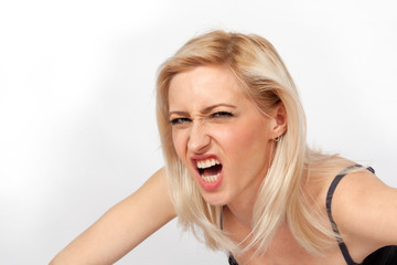 Young attractive blonde woman angry
