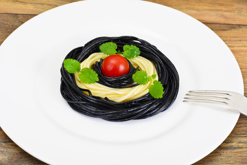 Black Spaghetti with Cuttlefish Ink, Tomato and Basil. Mediterra