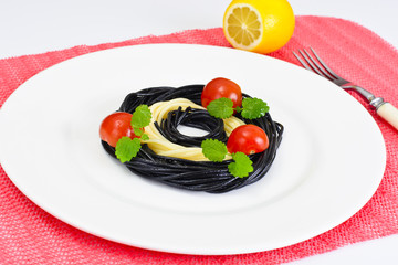 Black Spaghetti with Cuttlefish Ink, Tomato and Basil. Mediterra