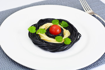 Black Spaghetti with Cuttlefish Ink, Tomato and Basil. Mediterra