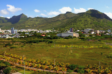 Fototapeta na wymiar City at mountain foot. Port Louis, Mauritius