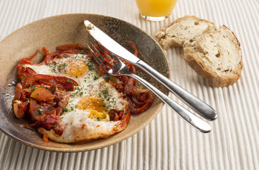Turkish spiced Menemen eggs with onions peppers, chilli & tomato 
