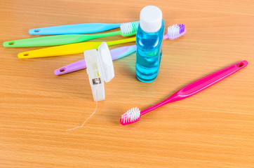 Set of colorful toothbrushs with dental floss