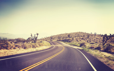 Vintage toned desert road, Joshua Tree National Park, California, USA.