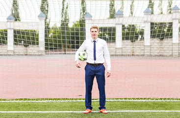 European Football Championship concept. Businessman playing soccer ball.