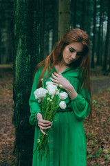 girl in green dress with flowers