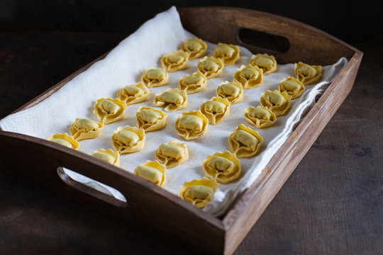 Close up of wontons on wooden tray