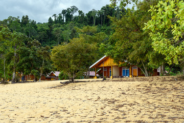Wooden bungalows on Siuri Beach at Poso lake. Indonesia