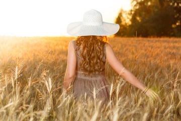 Portrait of young pretty girl dressed in bright hat 