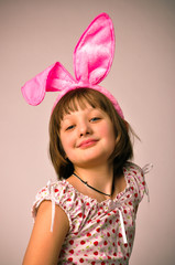 Portrait of the girl - teenager. At the head put on the ears of a rabbit carnival costume.

