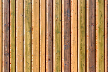 Colorful board on board fence