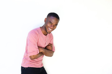 Young african man laughing with arms crossed