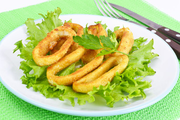 Fried Squid Rings in Breadcrumbs with Lettuce and Lemon