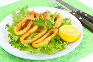Fried Squid Rings in Breadcrumbs with Lettuce and Lemon