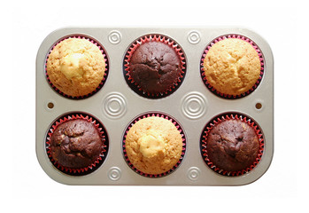 Homemade muffins in a baking tray isolated on a white background. Top view