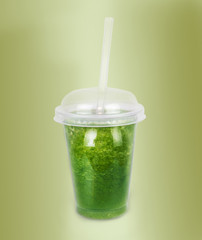 Green smoothie with a straw. Vegetable cocktail. Healthy organic
