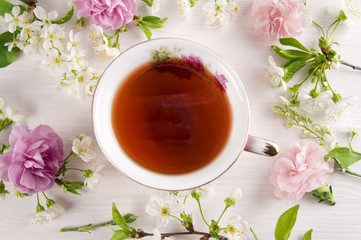 Tea with cherry blossom flowers, macaroons. Spring concept