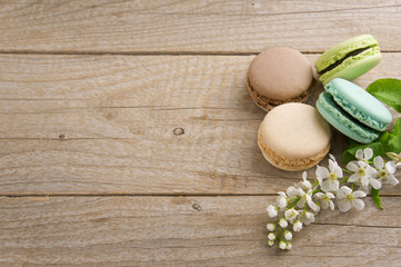 Fototapeta na wymiar French macaroons on a vintage background. Turquoise, chocolate a