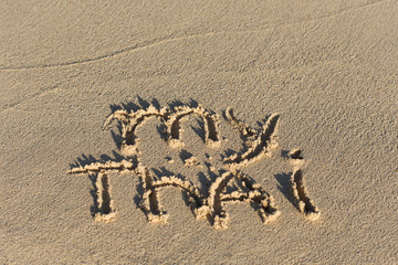 Inscription My Thai on sandy beach
