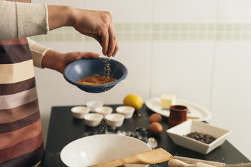 Beautiful woman Preparing Cookies And Muffins.