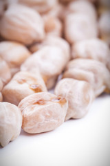 Raw dry chickpeas on white background