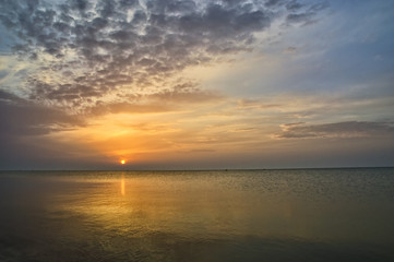 Magic cloudy sunset at the seaside