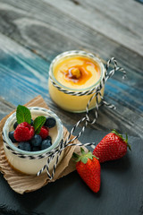 Jar with fresh yogurt on a rustic table