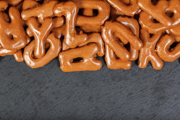 Alphabet cookies on a slate plate