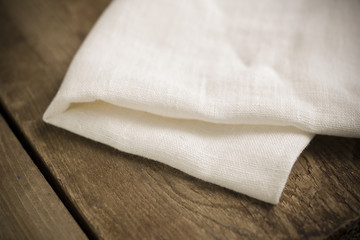 Fototapeta na wymiar Folded White Cotton Fabric or Linen