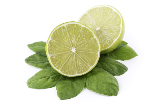 fresh limes / lemons with mint on white background