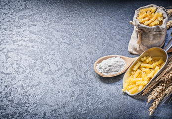 Sacking bag uncooked macaroni kitchen scoop wood spoon flour whe