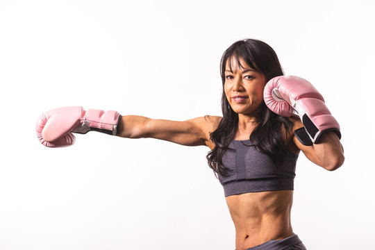 Fitness woman wearing boxing gloves
