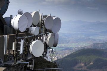 Bunch of transmitters and aerials on the telecommunication tower