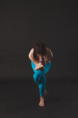 Beautiful sporty yogi girl practices yoga asana