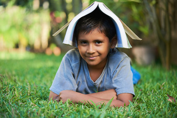 kid with book on head © PixieMe