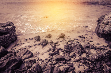 stone at sea beach , vintage , sunlight  summer background