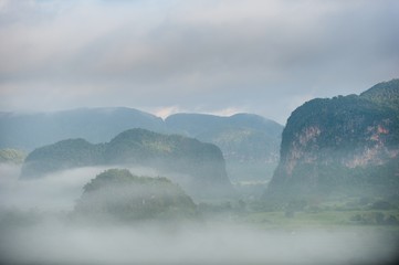 Aerial View across the Vinales Valley in Cuba. Morning twilight and fog. Fog at dawn in the Valley of Vinales in Pinar del Rio